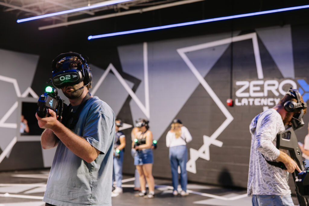 Group playing free-roam VR at Rec Hall in St. Charles, Missouri, a bachelor party idea in St. Louis