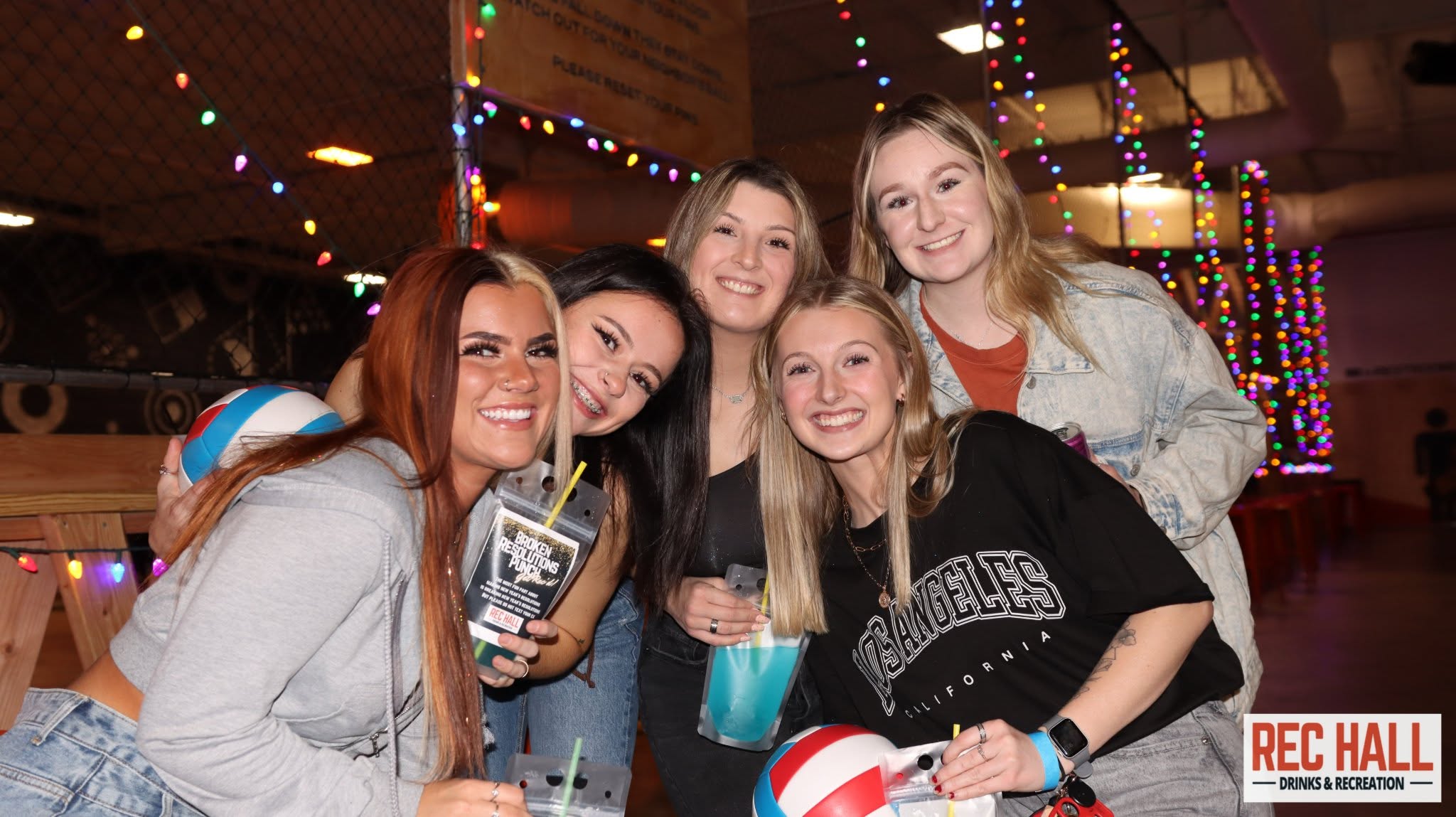 Group of friends enjoying a game night at Rec Hall in St. Charles, Missouri