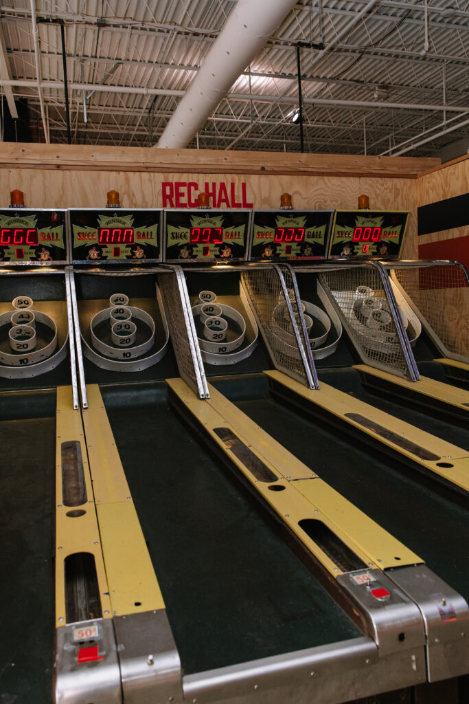 Skee-ball lanes at Rec Hall in St. Charles, Missouri, a good place to sharpen your aim and learn how to hold a pool cue